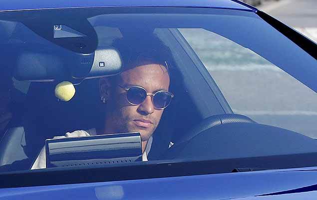 Brazilian soccer player Neymar drives to arrive to Joan Gamper training camp near Barcelona